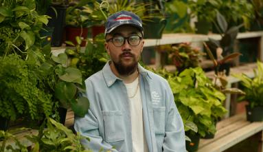 jason chu sitting among plants